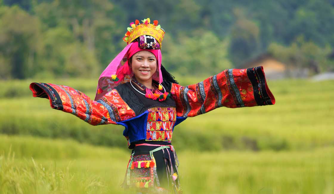 Young smiling girl in the ethnic clothes
