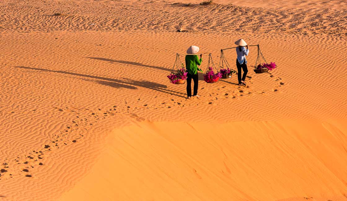 People walking on the sand dunes